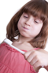 Image showing girl brushing her teeth with a toothbrush