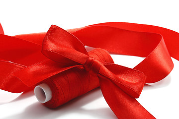 Image showing Red bow and threads