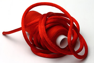 Image showing Red threads and red band