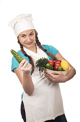 Image showing girl cook and products on white background