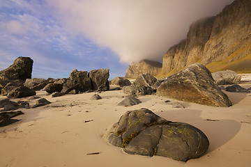 Image showing Boulders on sandy beach