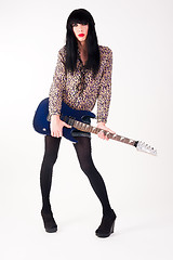 Image showing transvestite in heels with electric guitar