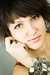 Image showing young brunette lady with bracelets