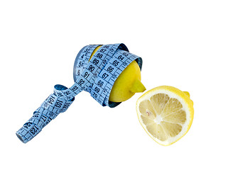 Image showing lemon rotated with blue centimeter and piece lemon 