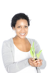 Image showing Smiling woman with sprouting sping bulbs