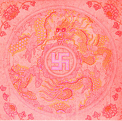 Image showing Drawing of a swastika with a dragon