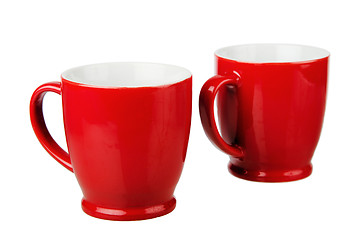Image showing Two red ceramic mug, isolated on white