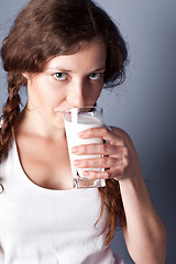 Image showing woman enjoying a glass milk
