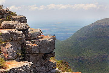 Image showing Rocky ledge overlooking a mountain valley