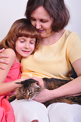 Image showing grandmother and granddaughter with their cat