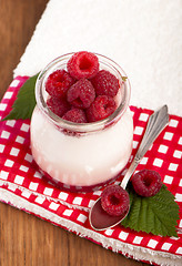 Image showing White yogurt with strawberry and spoon