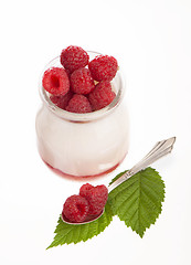 Image showing Fresh Yogurt in a jar with Raspberries, leaves