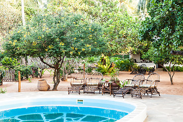 Image showing Chairs on swimming pool border