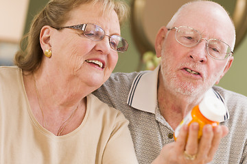 Image showing Senior Couple Reading Medicine Bottle