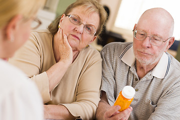 Image showing Doctor or Nurse Explaining Prescription Medicine to Senior Coupl