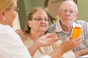 Image showing Doctor or Nurse Explaining Prescription Medicine to Senior Coupl