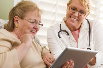 Image showing Doctor or Nurse Talking to Senior Woman with Touch Pad