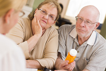 Image showing Doctor or Nurse Explaining Prescription Medicine to Senior Coupl