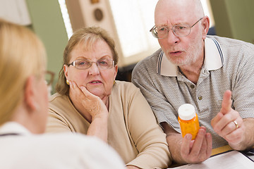 Image showing Doctor or Nurse Explaining Prescription Medicine to Senior Coupl