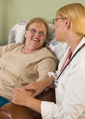 Image showing Doctor or Nurse Talking to Sitting Senior Woman