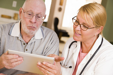 Image showing Doctor or Nurse Talking to Senior Man with Touch Pad