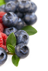 Image showing Many blueberries & raspberries.