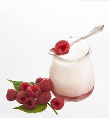 Image showing Fresh Yogurt in a jar with Raspberries, leaves