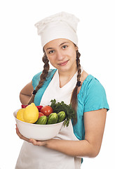 Image showing girl cook and products on white background