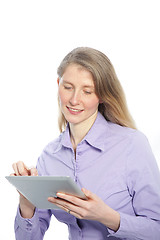 Image showing Middle-aged woman using a tablet