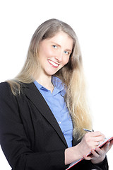 Image showing Smiling businesswoman writing notes