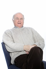 Image showing Happy senior man relaxing in a chair