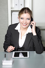 Image showing Businesswoman taking a call on her mobile