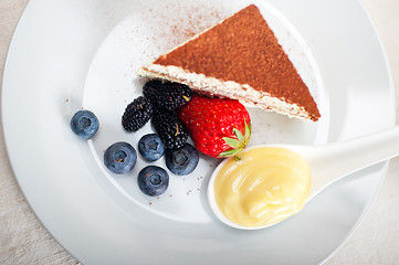 Image showing tiramisu dessert with berries and cream