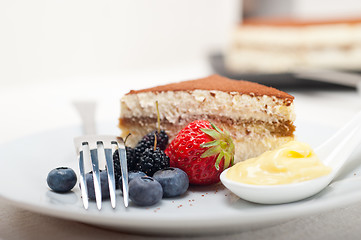 Image showing tiramisu dessert with berries and cream