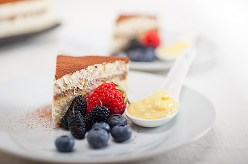 Image showing tiramisu dessert with berries and cream