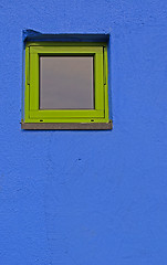 Image showing Green window on blue wall