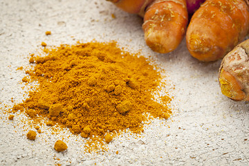 Image showing turmeric powder  and root