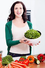 Image showing young woman cooking vegetarian food