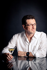 Image showing adult man holding an alcoholic drink