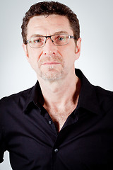 Image showing attractive adult man with glasses and black shirt