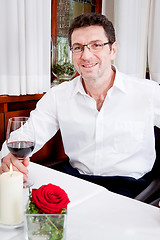 Image showing couple drinking red wine in restaurant