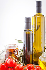 Image showing tatsty geen olives tomatoes and olive oil 