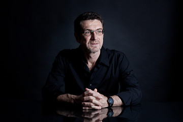 Image showing attractive adult man with glasses on black background