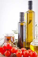 Image showing tatsty geen olives tomatoes and olive oil 