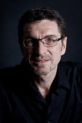 Image showing attractive adult man with glasses on black background