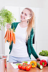 Image showing young woman cooking vegetarian food