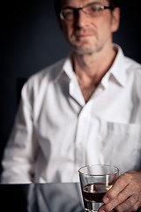 Image showing adult man holding an alcoholic drink