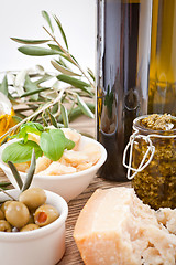 Image showing tatsty geen olives parmesan and olive oil 