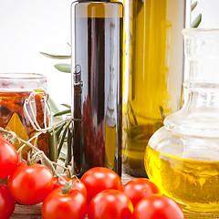 Image showing tatsty geen olives tomatoes and olive oil 