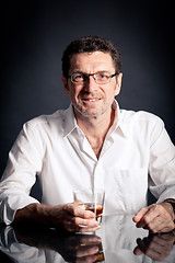 Image showing adult man holding an alcoholic drink